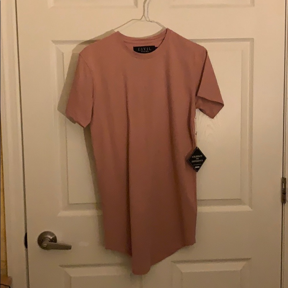 A pinkish, tan shirt